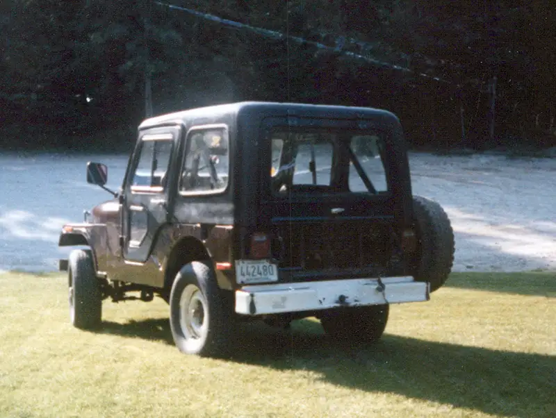 1976 Jeep CJ-5 with hard top, rear three-quarter view on grass