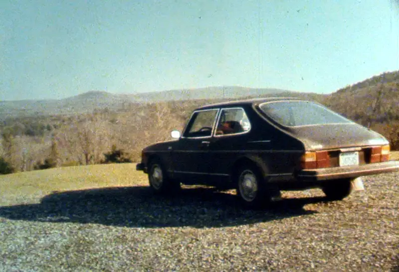 Dark Saab 900 with New Hampshire hills in the background